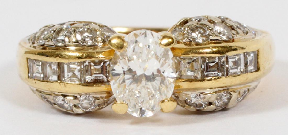 2.42 CT. DIAMOND ENGAGEMENT RING 18KT YELLOW GOLD: 2.42 CT. DIAMOND ENGAGEMENT RING, 18KT YELLOW GOLD :Having an 18 kt yellow gold band with a 1.10 ct oval cut center diamond flanked by eight square cut diamonds, four per side, with an approximate 0.4
