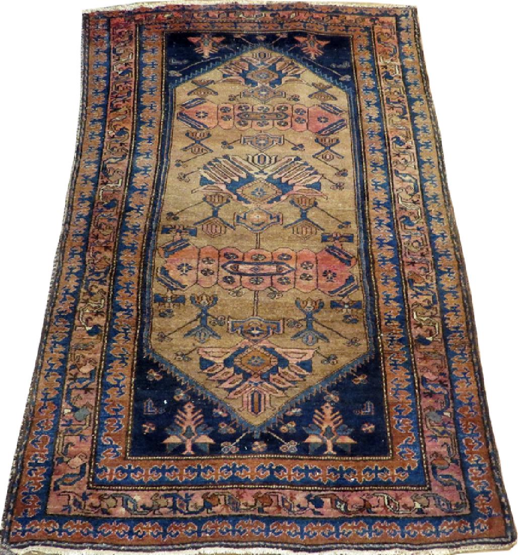 PERSIAN HANDWOVEN RUG, C.1920, 6' 8" X 4' 4": PERSIAN HANDWOVEN RUG, C.1920, 6' 8" X 4' 4" :A light brown ground with navy canted corners, saw-tooth edging. Antique. From the Estate of Dr. Henry and Grace Stricker, Milford, Michigan.