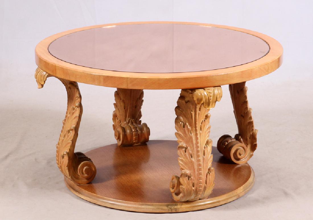 WOOD AND GLASS COFFEE TABLE: WOOD AND GLASS, COFFEE TABLE, H 19 1/4", DIA 33 1/2"A carved wood coffee table with a mirror top.