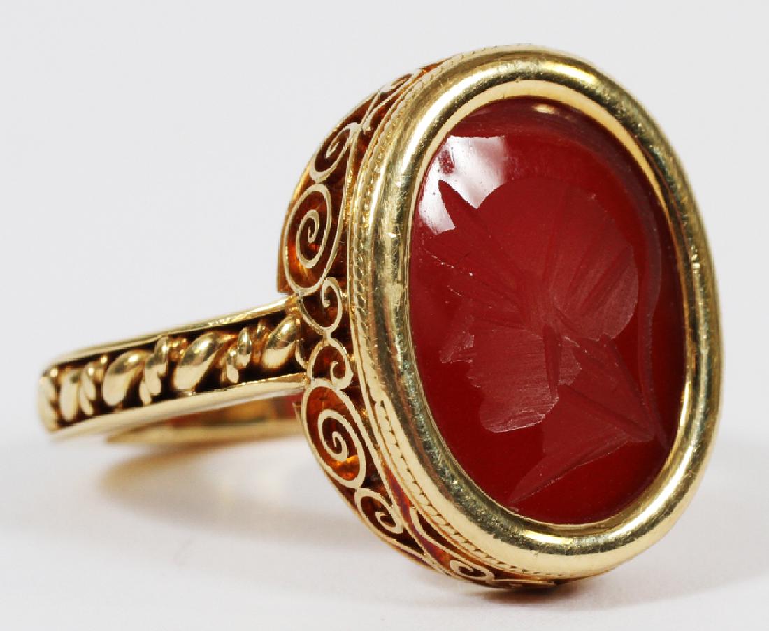 MANS 18KT YELLOW GOLD RING WITH RED INTAGLIO: MANS 18KT YELLOW GOLD RING WITH RED INTAGLIO Marked "750". Purchased in Greece.
