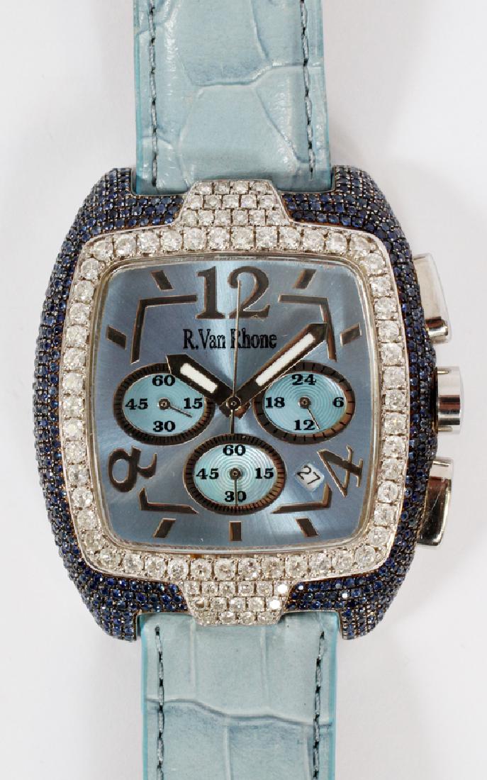R. VAN RHONE LADY'S DIAMOND & BLUE STONE WATCH: R. VAN RHONE LADY'S DIAMOND & BLUE STONE WATCH, L 9'' :A LADY'S WATCH BY R. VAN RHONE, COMPOSED OF A STAINLESS STEEL BODY WITH A SQUARE FACE. THE FACE IS FRAMED WITH DIAMONDS AND BLUE STONES. THE BODY