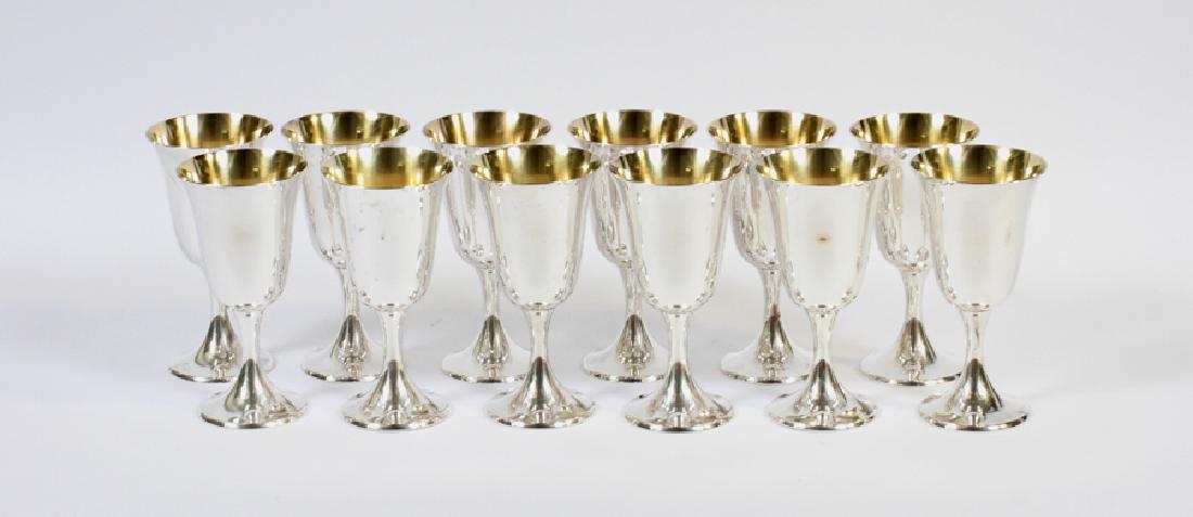 GORHAM STERLING SILVER WINE GOBLETS, 12, H 6 5/8": GORHAM STERLING SILVER WINE GOBLETS, 12, H 6 5/8" :having flared rims and gold wash interiors. Marked: "Gorham 252" on the undersides. 70.10 tr. oz total wt.