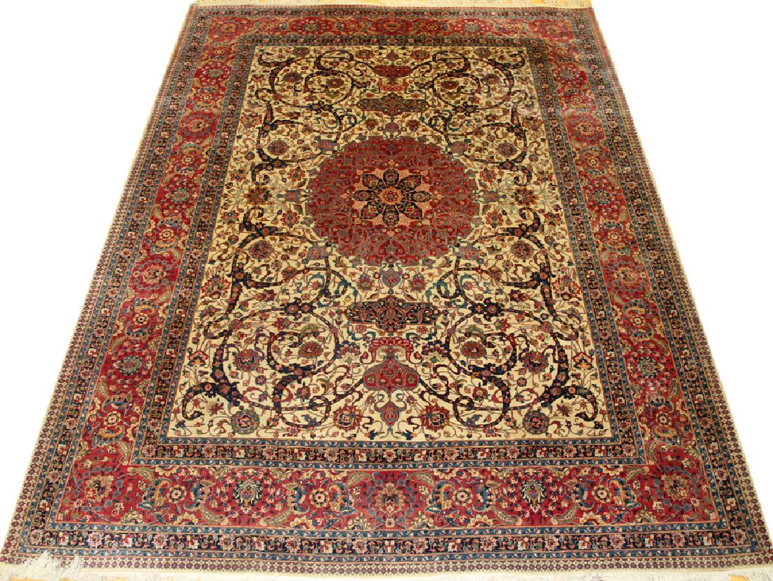 PERSIAN ANTIQUE MESHED HAND WOVEN WOOL CARPET: PERSIAN ANTIQUE MESHED HAND WOVEN WOOL CARPET, W 9' 10 1/2", L 12' 11" :Ivory ground. Rose and navy medallion with floral and scrolling designs.