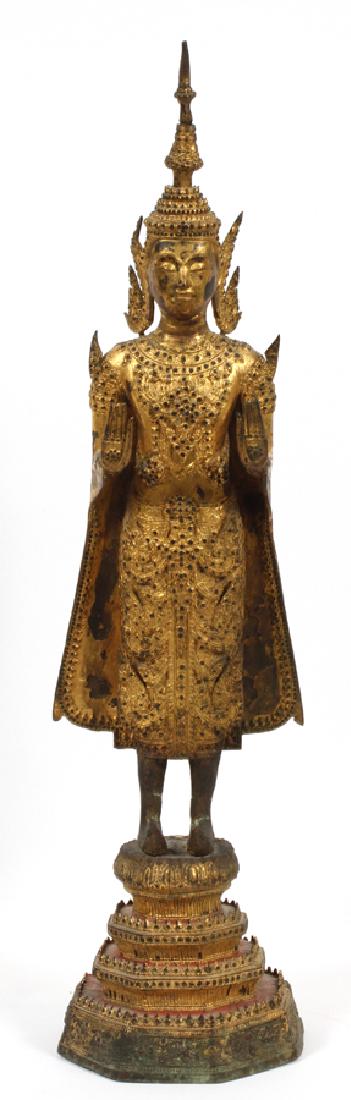 THAI GILT BRONZE SCULPTURE BUDDHIST POSE: THAI GILT BRONZE SCULPTURE, H 26 1/2", DIA 6 1/2", BUDDHIST POSE :A gilt bronze sculpture attributed to Thai culture. This piece depicts the Buddhist pose 'repelling the ocean' or 'forbidding the figh