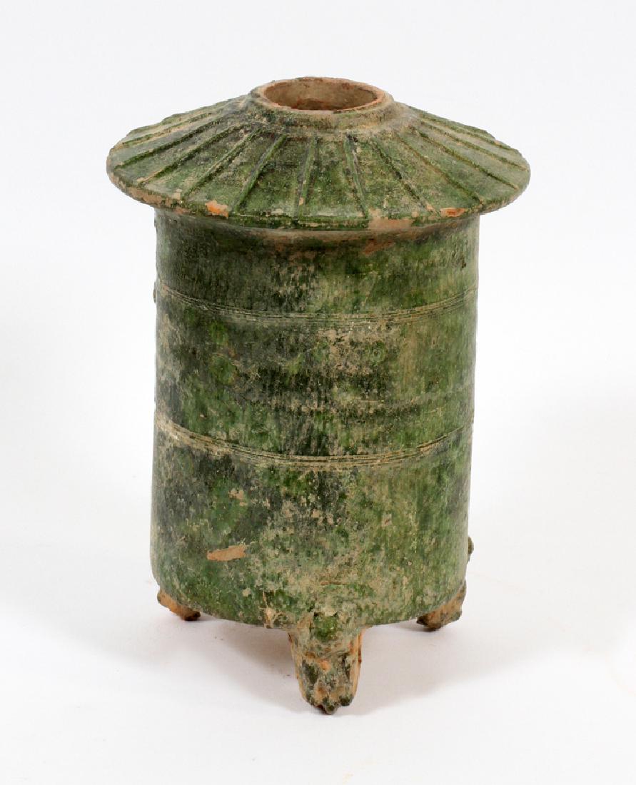 CHINESE EARTHENWARE RICE HOUSE, HAN DYNASTY: CHINESE EARTHENWARE RICE HOUSE, HAN DYNASTY, H 9 1/2", DIA 7 1/2":A Chinese earthenware figurine, attributed to the Han Dynasty (ca. 206 BCE-220 CE). This piece depicts a rice house with a green glaze