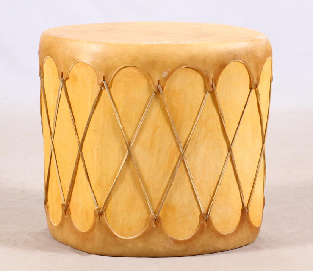 NATIVE AMERICAN 'TAOS' TREE TRUNK & RAW HIDE DRUM: NATIVE AMERICAN, 'TAOS' TREE TRUNK AND RAW HIDE, DRUM, H 19", W 21", D 18" :Native American 'Taos' tribe, carved tree trunk drum with rawhide skins. c1900. Per the consignor similar item in the Smiths