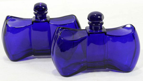 BACCARAT ART DECO CRYSTAL PERFUME BOTTLES: BACCARAT ART DECO BLUE CRYSTAL PERFUME BOTTLES, PAIR, H 3 1/2", W 5":having bowtie shape.