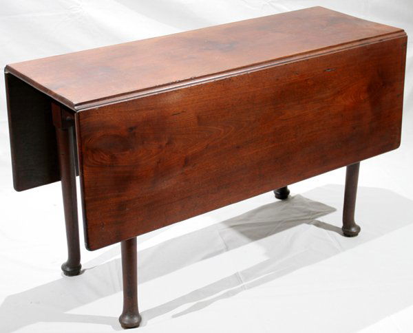QUEEN ANNE STYLE ENGLISH MAHOGANY TABLE: QUEEN ANNE STYLE ENGLISH MAHOGANY DROP LEAF TABLE, 19TH CENTURY, H 28", W 17" (CLOSED), L 48":Having straight legs and pad feet; W 47" when leaves are opened. Ex prominent collector, Ann Arbor, Mi.