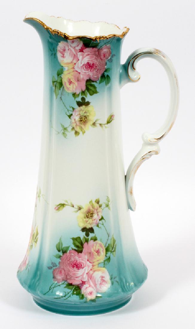 BAVARIAN CERAMIC PITCHER, CIRCA 1900: BAVARIAN CERAMIC PITCHER, CIRCA 1900, H 15 1/2'' MOTIF OF ROSES :Light blue to white ground with rose decorations. R.C., "Alice", Bavaria mark. Gilded upper edge.