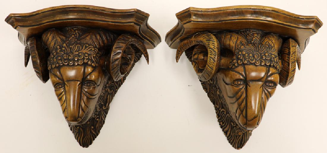 WOOD WALL PEDESTALS, PAIR, H 10", W 12", D 7": WOOD WALL PEDESTALS, PAIR, H 10", W 12", D 7":A pair of hand-carved wood wall pedestals. These pieces depict a sculpture sheep motif. The pair are made in the Philippines and designed by Maitland-Smit