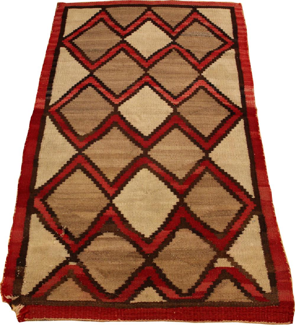 NAVAJO WOVEN RUG, ARIZONA CIRCA 1900: NAVAJO WOVEN RUG, ARIZONA CIRCA 1900 W 3'2" L 5'2" :Red border. Diamond forms. Hand woven.