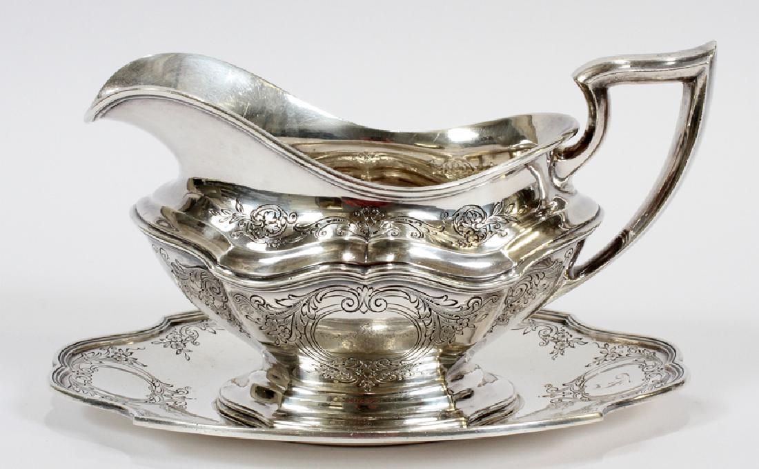 REED AND BARTON STERLING "HEPPLEWHITE" SAUCE BOAT: REED AND BARTON STERLING "HEPPLEWHITE" SAUCE BOAT ON TRAY #560 L 8" :Monogram "F". Circa 1920. Total weight: 17.55 troy ounces.