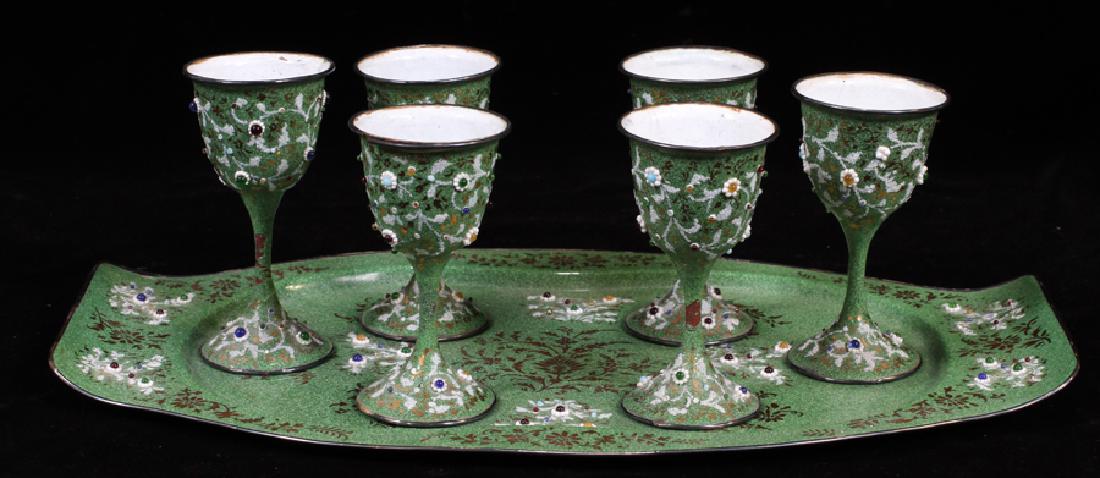 ENAMELED WINE SET WITH TRAY: ENAMELED WINE SET WITH TRAY, (SIX), H 3 3/4", W 13 1/4" :Enameled wine set. Seven pieces: six glasses with a tray. Green ground with glass jewels. Cups H 3 3/4". Tray L 13 1/4". Unmarked,