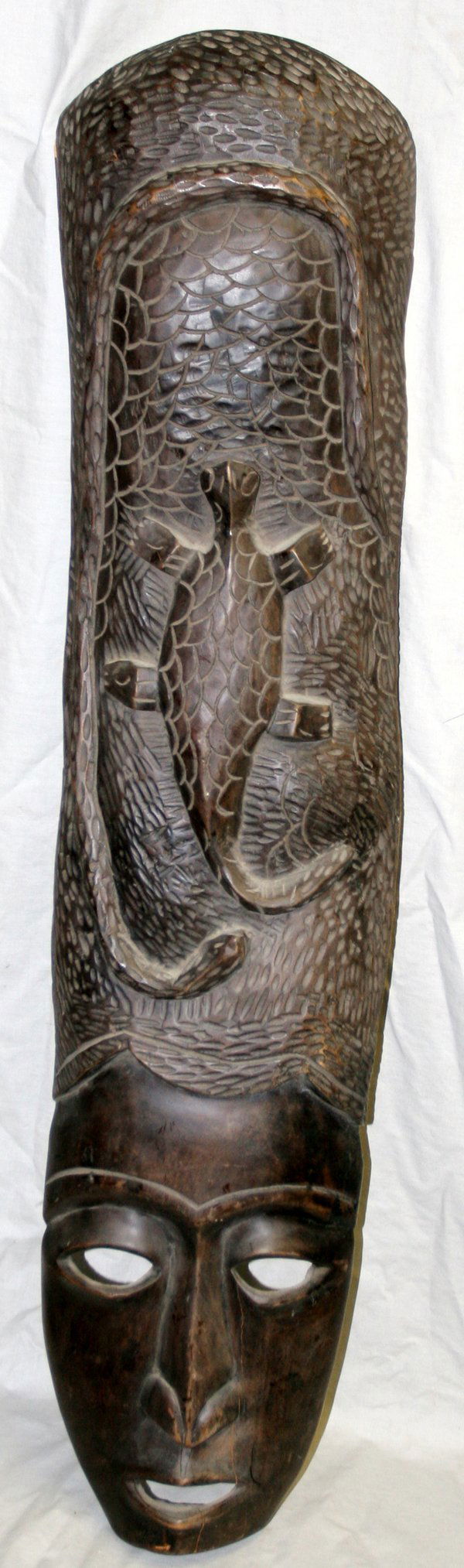 AFRICAN TURTLE & SNAKE MOTIF MASK, H41" W9": AFRICAN TURTLE & SNAKE MOTIF MASK, H 41", W 9":Mask surmounted with elaborate high headdress in motif of turtle and snake. Estate of Richard Titlebaum, Ann Arbor.