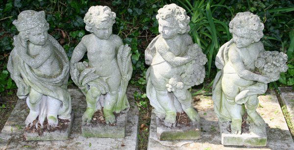 CEMENT LAWN SCULPTURES, "FOUR SEASONS": CEMENT LAWN SCULPTURES 4 PCS. 22" H. X 7" SQUARE BASE. "FOUR SEASONS":catalog photograph depicts from right to left: "spring", "summer", "fall" and "winter".
