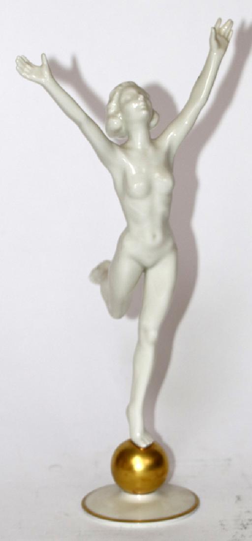 HUTCHENREUTHER WHITE PORCELAIN FIGURE: HUTCHENREUTHER, WHITE PORCELAIN FIGURE, H 14", W 6 1/4", NUDE FEMALE DANCER On fired gold globe with outstretched hands. Hutchenreuther mark on the underside