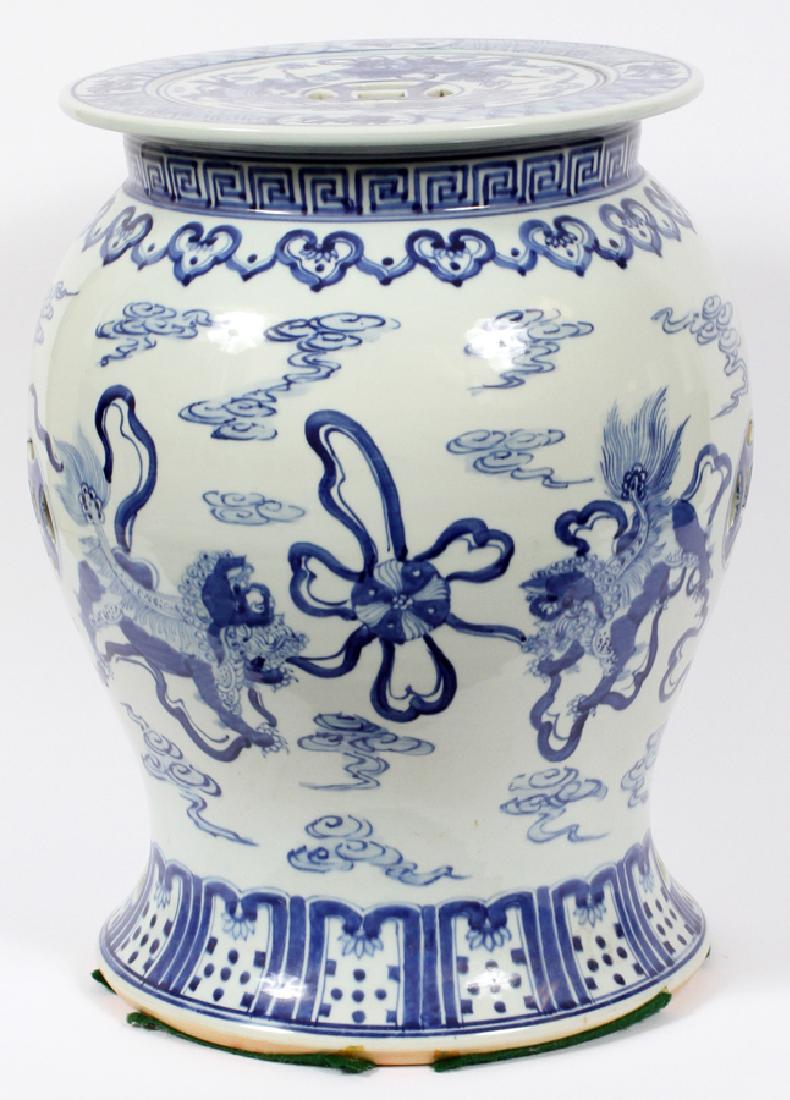 CHINESE BLUE & WHITE PORCELAIN PAINTED GARDEN SEAT: CHINESE BLUE & WHITE PORCELAIN PAINTED GARDEN SEAT, H 20'', DIA 15'' Large blue and white porcelain garden seat. Abstract Chinese embellishments with dragon motif. H 20'', DIA 15''.
