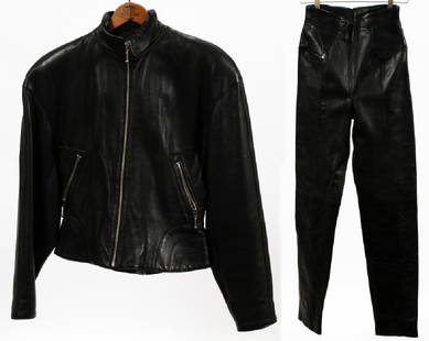 MICHAEL HOBAN LEATHER JACKET AND PANTS SIZE 7/8: MICHAEL HOBAN LEATHER JACKET AND PANTS SIZE 7/8 Black leather jacket and pants both are a size 7/8. The jacket has a zipper front and two zipper pockets, there is a buckle at the back to make the jack