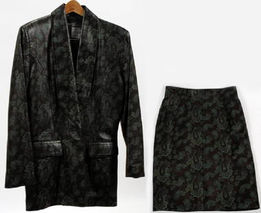 MICHAEL HOBAN LEATHER BLAZER AND SKIRT SIZE 9/10: MICHAEL HOBAN LEATHER BLAZER AND SKIRT SIZE 9/10 Matching leather blazer and skirt, having a black ground with a blue paisley design. Size 9/10. The blazer has two flap pockets and buttons down the fr