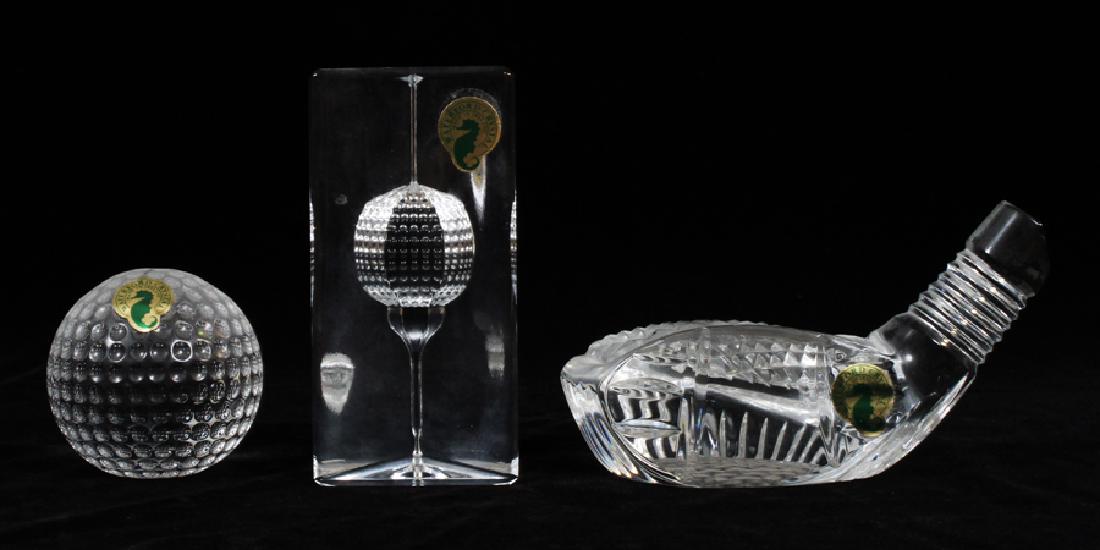 WATERFORD CRYSTAL GOLF THEME SCULPTURES: WATERFORD CRYSTAL GOLF THEME SCULPTURES, THREE H 2 1/2" - 4 1/2" Waterford club head L 5 1/2". Waterford crystal golf ball sculpture 2 1/2". Waterford paperweight with golf ball H 4 1/2
