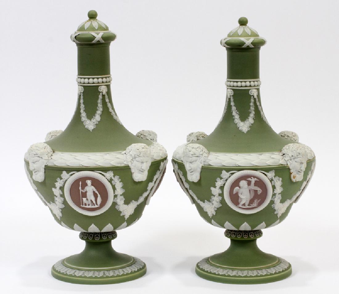 WEDGWOOD ENGLAND PORCELAIN JASPER DIP BOTTLES: WEDGWOOD, ENGLAND, TRI-COLOR PORCELAIN, JASPER DIP, COVERED BARBER BOTTLES, C. 19TH C, PAIR, H 10", DIA 6" :Having a light green jasper dip ground, with a small cap atop a long narrow neck with white