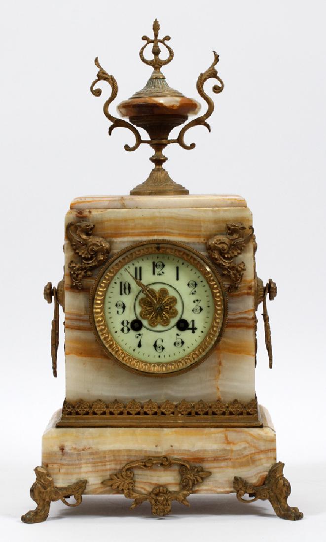 FRENCH ONYX MANTEL CLOCK, H 17", W 9", D 5 1/2": FRENCH ONYX MANTEL CLOCK, H 17", W 9", D 5 1/2":An antique French onyx mantel clock featuring ornate gold tone ormolu scroll work on an orange tone onyx bodice. No key included.