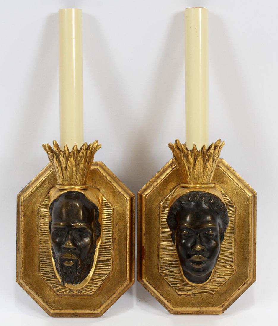 BRONZE & WOOD SCONCES, PAIR: BRONZE & WOOD SCONCES, PAIR, H 12", W 4 3/4", D 3 1/2" :A pair of electric bronze and gilt wood sconces. Each piece features the profile of a man or woman with relief gilt bronze candle cups and candl