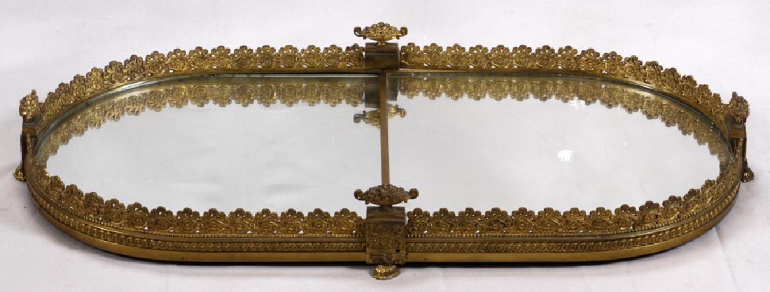 FRENCH BRONZE FRAME WITH MIRROR TABLE PLATEAU: FRENCH BRONZE FRAME WITH MIRROR TABLE PLATEAU, IN TWO PARTS. W 19.5" L 42" :Height of outer floral pierced gallery 5". Each section is 21" long. Well constructed wood under support. Oval ends surmount