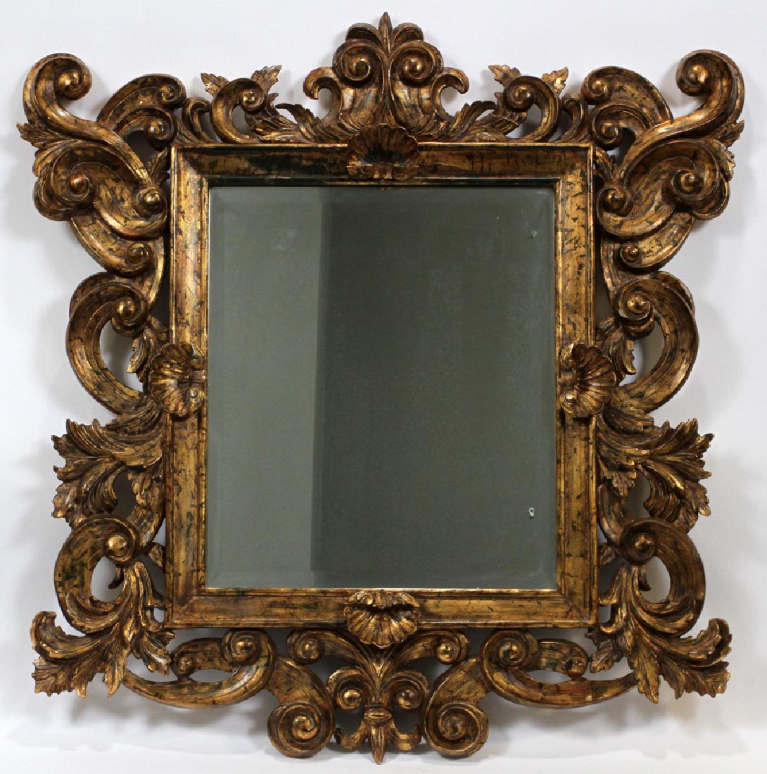 ITALIAN ROCOCO-STYLE CARVED WOOD MIRROR: ITALIAN ROCOCO-STYLE CARVED WOOD MIRROR, H 39 1/2", W 39" :A 20th century mirror with a square plate surmounted by a pierced scrolling foliate and shell-carved carved frame. Provenance: ESP Design, Bl