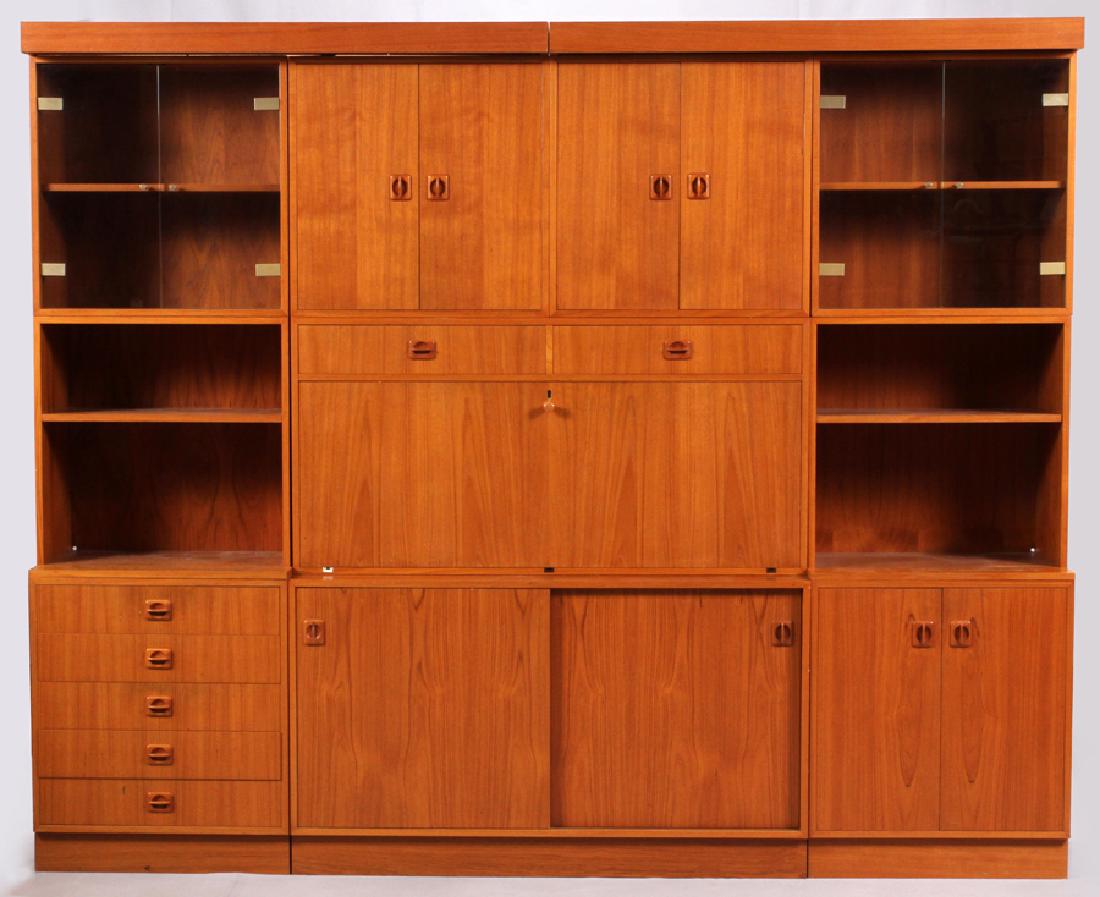 DANISH, MODERN, TEAKWOOD, STACKABLE WALL UNIT: DANISH, MODERN, TEAKWOOD, STACKABLE WALL UNIT, H 77", L 95", D 16":A Danish mid-century modern stackable wall unit made of Teakwood. Flanked by drawers and wood-paneled cabinets.