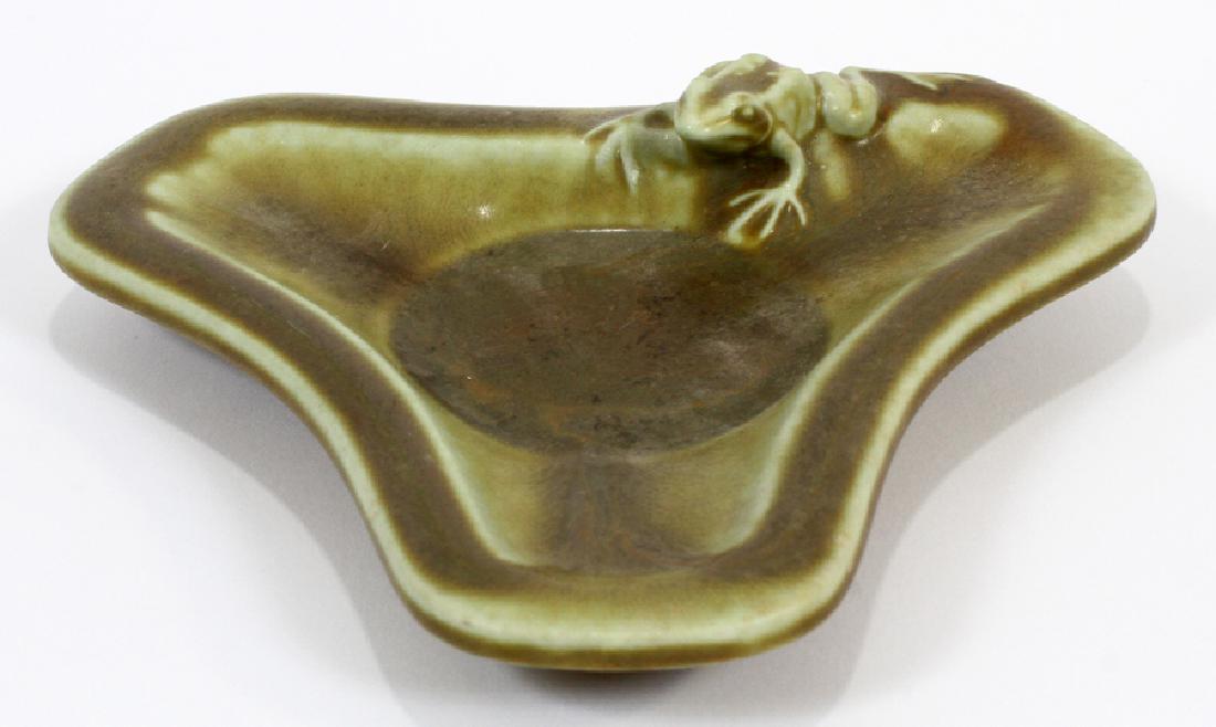 ROOKWOOD POTTERY ASH RECEIVER, C. 1926: ROOKWOOD POTTERY ASH RECEIVER, C. 1926, H 1 1/2", W 6 1/2", D 5 1/2":An artful Rookwood Pottery Company ash receiver in a green drip matte finish. Year XXVI (1926) design #2765 with the Rookwood Flame