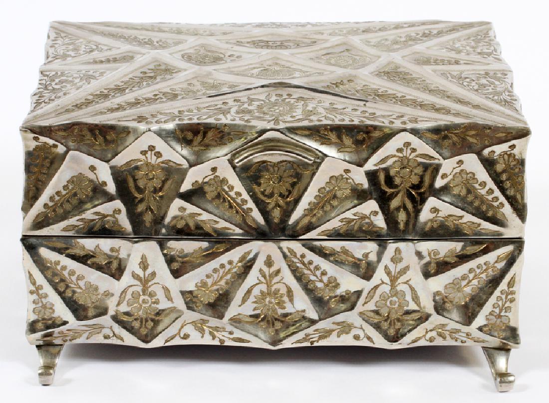 FRED ZIMBALIST CO./THERONS SILVER PLATE MUSIC BOX: FRED ZIMBALIST CO./THERONS SILVER PLATE MUSIC BOX, H 5", L 8.5" D 8" :The music box features a rectangular design enhanced with engraved floral's and vines raised on scrolled leg. The interior is fitt