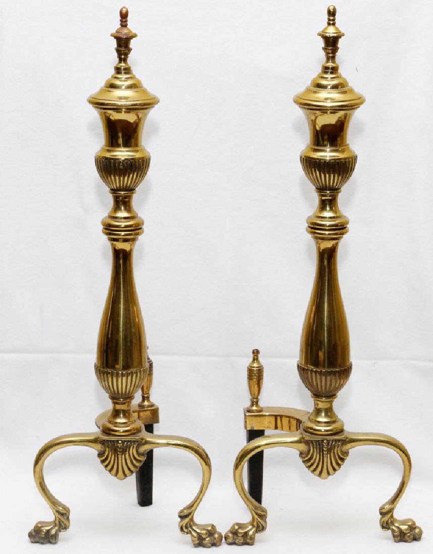 FEDERAL STYLE BRASS ANDIRONS, PAIR, H 23": FEDERAL STYLE BRASS ANDIRONS, PAIR, H 23":A pair of andirons, with curving leaf into paw feet. Each measures H.23" x 8". Contemporary. From the Estate of Daniel Clancy, Voltaire Place, Grosse Pointe F