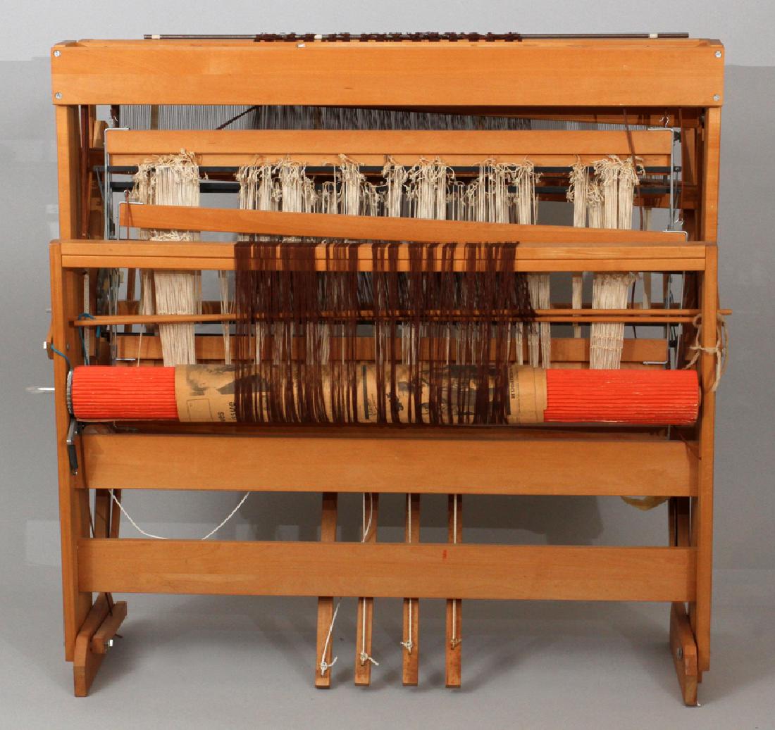 HARRISVILLE DESIGNS FLOOR LOOM: HARRISVILLE DESIGNS FLOOR LOOM, H 42 1/2", W 42", D 13":A Harrisville Designs floor loom. The loom is Model T, and comes with additional mechanical parts and a tailor made bench from the previous owne