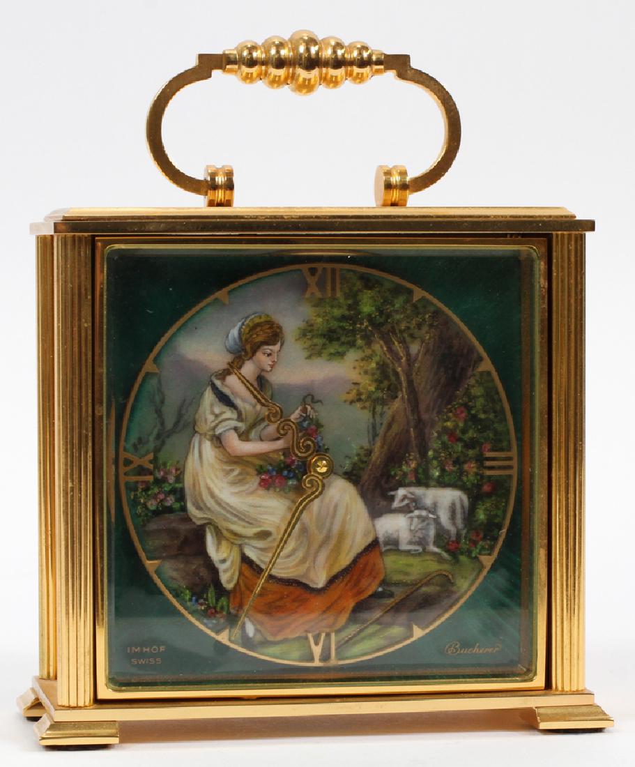 BUCHERER IMHOF SWISS CARRIAGE CLOCK: BUCHERER IMHOF SWISS CARRIAGE CLOCK, BRASS AMD ENAMEL, H 6", W 4 3/4", D 2":A Bucherer Imhof Swiss carriage clock. This brass encased clock features a scroll form hands, Roman numerals, and an enamel
