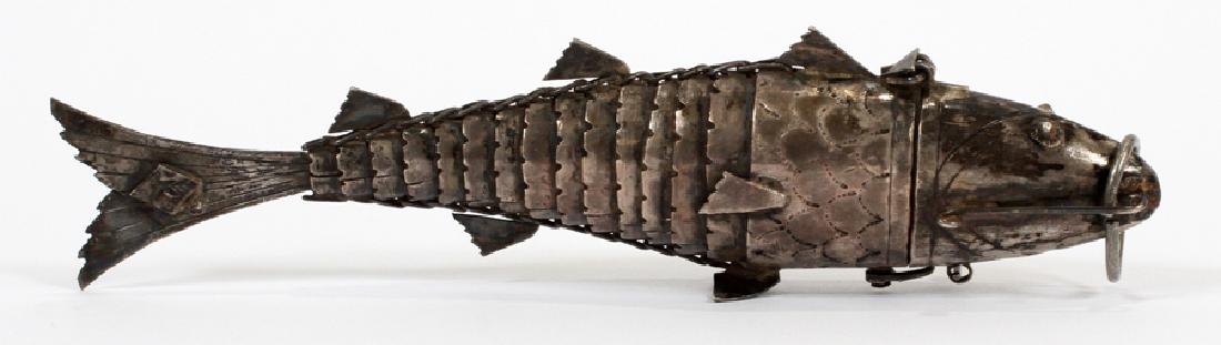 CHINESE STERLING SILVER RETICULATED FISH: CHINESE STERLING SILVER RETICULATED FISH, H 1.25", W .75", D 5", 1.25 TOZ :An antique Chinese unmarked sterling silver reticulated fish. This kinetic piece features as a pillbox complete with a lockin