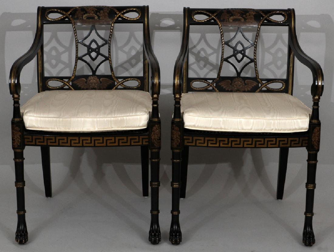 PAIR GOTHIC BLACK LACQUERED OPEN ARM CHAIRS: PAIR GOTHIC BLACK LACQUERED OPEN ARM CHAIRS H 33" W 21.5" D 21" :Pair of Gothic influence black lacquered open arm chairs. Having caned seats, upholstered watered silk taffeta cushion. Painted mask an