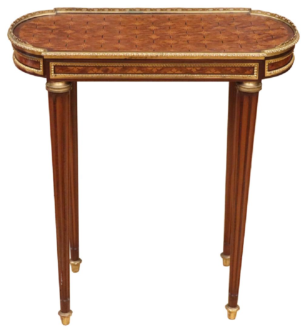 FRENCH, MARQUETRY INLAID TOP BRONZE ORMOLU TABLE: FRENCH, MARQUETRY INLAID TOP BRONZE ORMOLU TABLE, H 26", W 12", L 25" :Having a bronze gallery. Marquetry inlaid floral top. Straight tapering fluted legs.