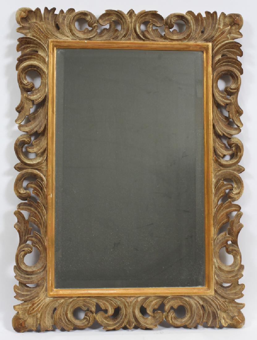 HARRISON & GIL, HAND CARVED WOOD MIRROR: HARRISON & GIL, HAND CARVED WOOD MIRROR, H 31 1/2", W 23" :Scrolling leaf design.