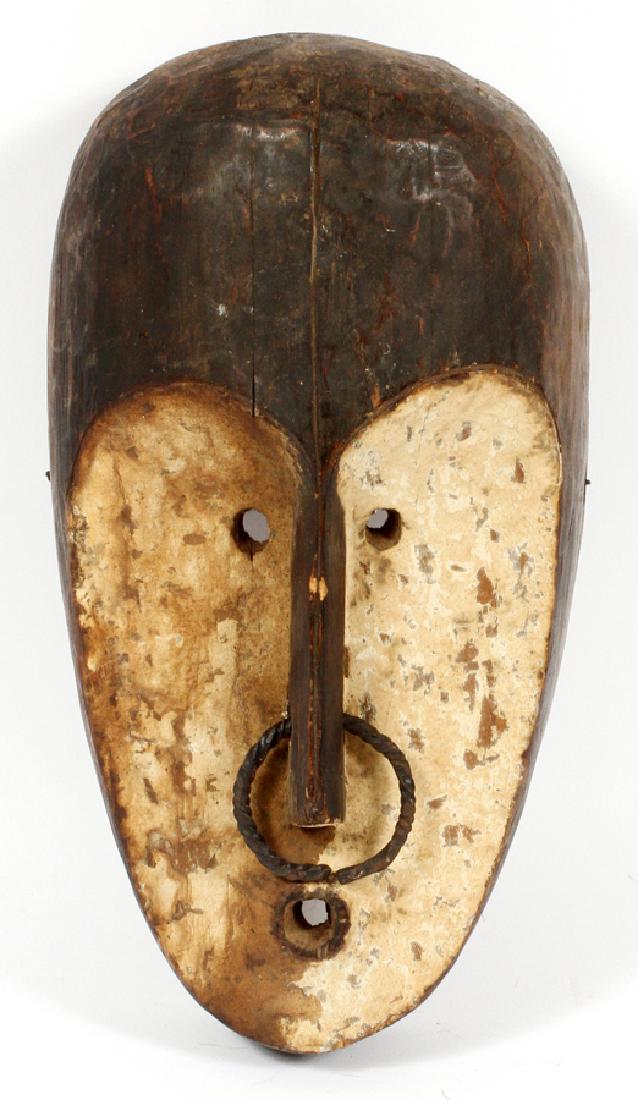 AFRICAN BEMBE JANIFORM TRIBAL MASK, H 13", W 7": AFRICAN BEMBE JANIFORM TRIBAL MASK, H 13", W 7":Depicts a child like ancestral face/spirit. Ring suspended in elongated nose. White face. Small narrow round eyes. Small round mouth. Small round ear ho
