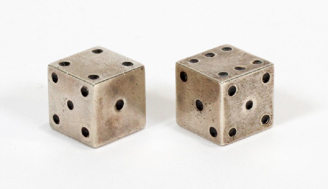 STERLING SILVER DICE, DIA .5", 1.96 TOZ: STERLING SILVER DICE, DIA .5", 1.96 TOZ:A pair of sterling silver dice. Each piece features black enamel denomination and a sterling silver hallmark impressed to one side. Total weight: 1.96 troy ounc