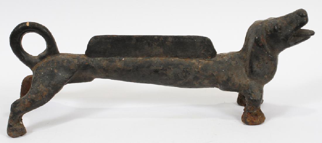 DOG FORM, IRON BOOT SCRAPER, 19TH C: DOG FORM, IRON BOOT SCRAPER, 19TH C, H 8", W 21", D 7" :Antique dog form iron boot scraper shaped like a dachshund. Measuring approximately 8" tall with a width of 21" and a 7" depth.