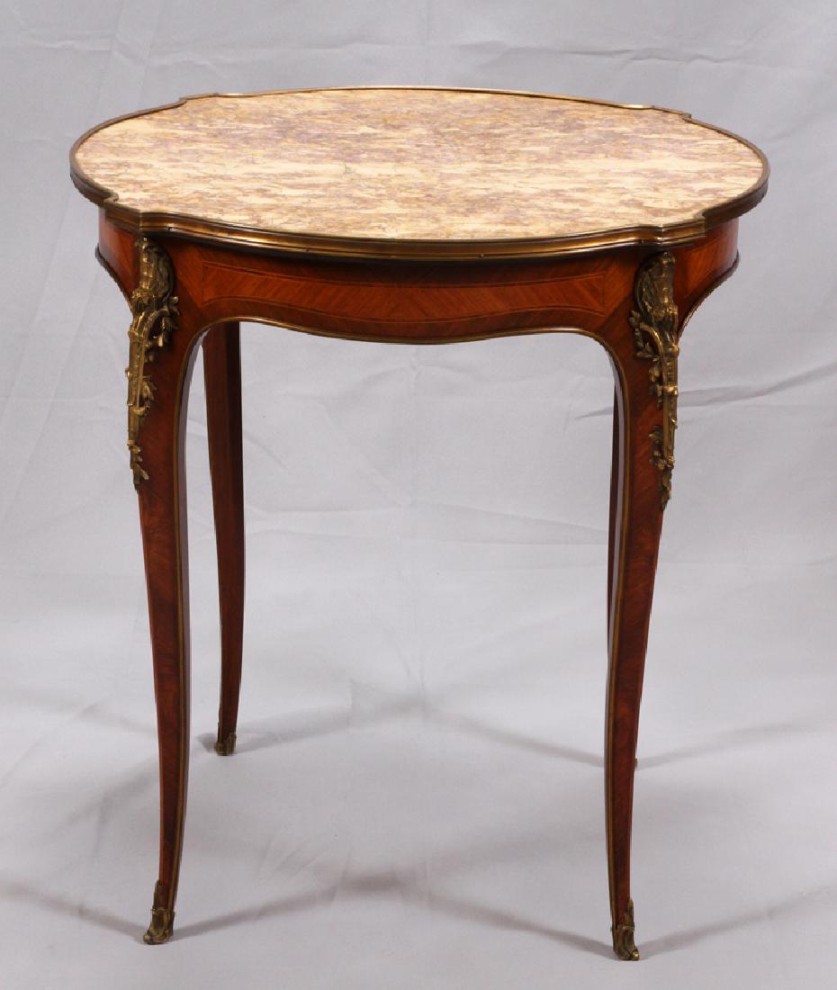 LOUIS XV STYLE FRUITWOOD & MARBLE TABLE: LOUIS XV STYLE FRUITWOOD & MARBLE TABLE, H 30", DIA 27":A Louis XV style fruitwood and mauve tone marble top table. This piece offers detailed marquetry, ormolu embellishment and four tapered cabriole