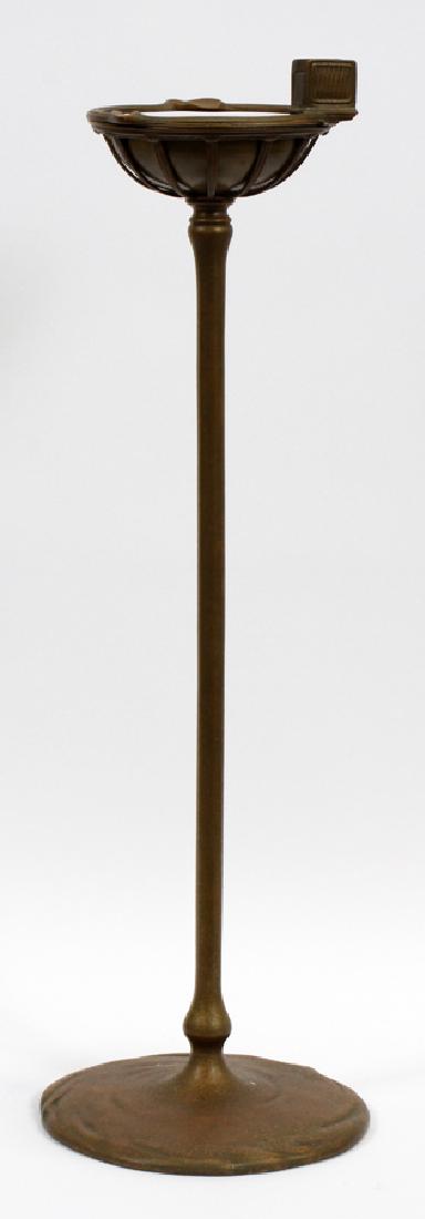 TIFFANY STUDIOS NEW YORK BRONZE STANDING ASHSTAND: TIFFANY STUDIOS #1649, NEW YORK BRONZE STANDING FLOOR ASHSTAND CIRCA 1900 H 27".75 :Dia 5.75. Hinged rim swings open to reveal dish for ashes. Crisp trademarks.