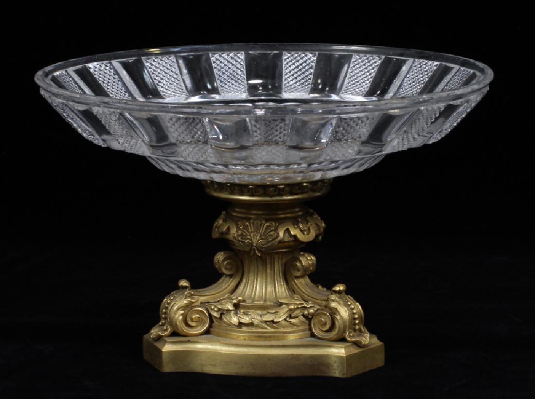 FRENCH, CRYSTAL & BRONZE CENTERPIECE: FRENCH, CRYSTAL & BRONZE CENTERPIECE, H 5 1/2", DIA 8 1/2" :Crystal bowl with repetitious diamond panels, alternating on a bronze base with leaf and scroll designs.