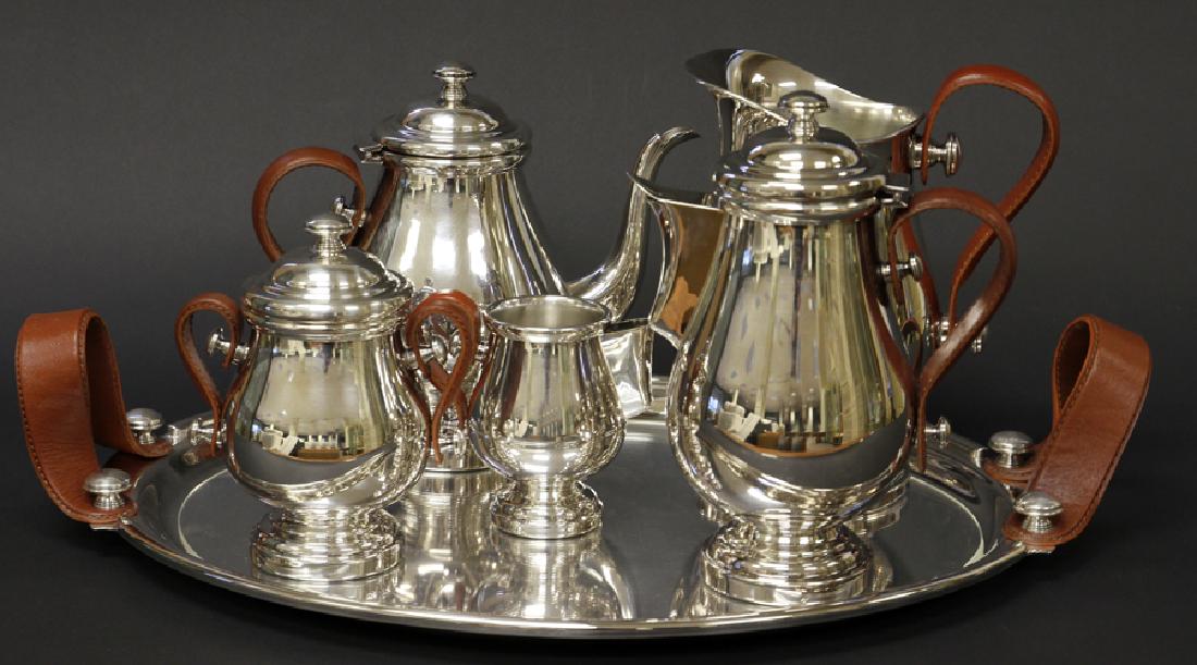 PLATA LAPPAS SILVERPLATE & LEATHER TEA & COFFEE SERVICE: PLATA LAPPAS SILVER PLATE AND LEATHER TEA & COFFEE SERVICE, 6 PCS, L 22.5", D 15":A rare Argentinian silver plate Plata Lappas tea and coffee service set. This set includes one water pitcher (H 9" x W