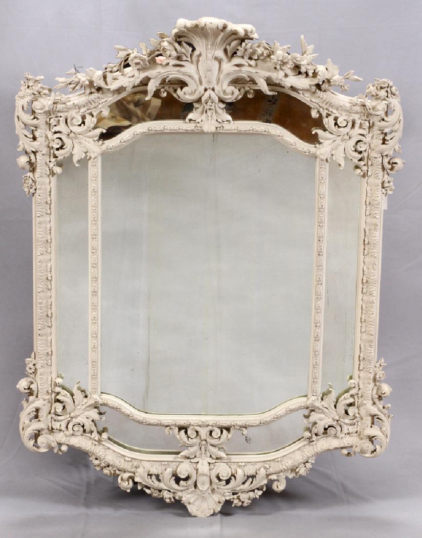 FRENCH ROCOCO CARVED MIRROR, 19TH C.: FRENCH ROCOCO CARVED MIRROR, 19TH C. H 52", W 37 1/2", D 6" :French Rococo panel mirror with elaborate carving. Having acanthus leaves, floral motifs, and elaborate rococo curvilinear patterns. One ce