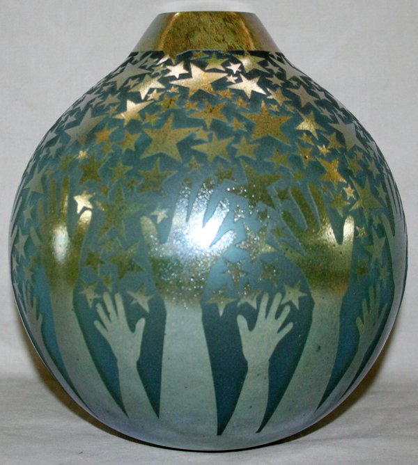 DUNCAN MCCLELLAN ART GLASS VASE, LATE 20TH C.: DUNCAN MCCLELLAN ART GLASS VASE, LATE 20TH CENTURY, H 8 3/4":Bulbous shape with cut stars and reaching hands accented in silver; signed.