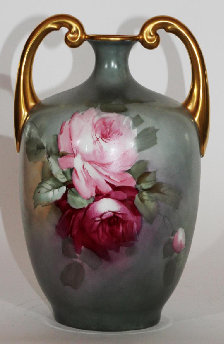 J.P. LIMOGES, HAND-PAINTED PORCELAIN VASE: J.P. LIMOGES, HAND-PAINTED PORCELAIN VASE, H 13", DIA 8.5"A signed J.P. Limoges hand-painted porcelain vase. This piece features scroll form handles, gilt accents and rose botanical motifs. Artist's s