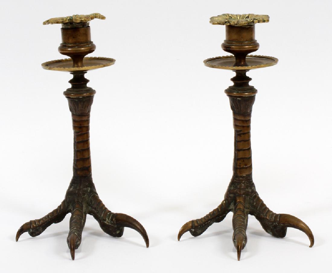 ENGLISH BIRD CLAW BRONZE CANDLE STICKS: ENGLISH, GOTHIC BIRD CLAW, BRONZE SINGLE LIGHT CANDLE STICKS, 2, H 7", W 6.5" Pair of patinated bronze single light candle sticks in the form of bird claws; likely Eagle. Removable candle cups. Measur